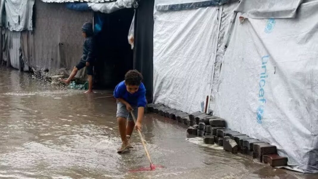 Floods swamp homeless Palestinians’ tents in Gaza as winter looms